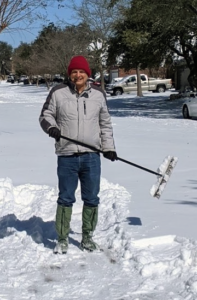 Scott sweeping snow away
