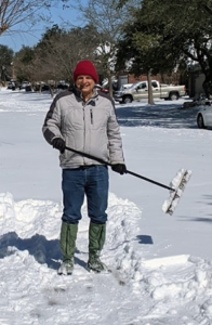 Scott sweeping snow away
