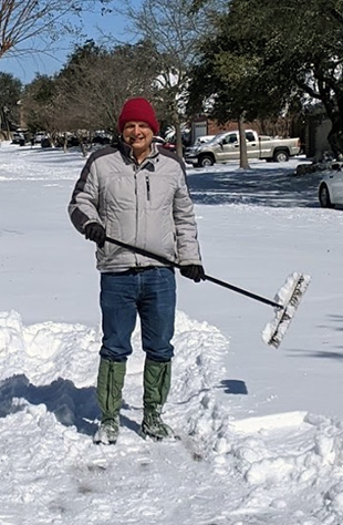 Scott sweeping snow away