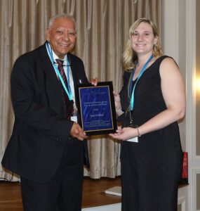 Leah Shuparski-Miller presenting the Meritorious Service Award to award to Sunil Choubal